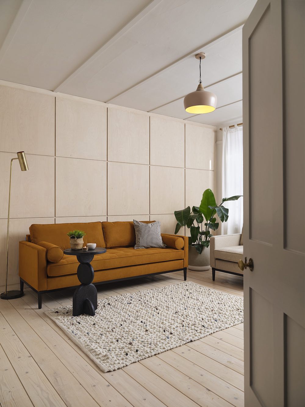 orange sofa with black side table