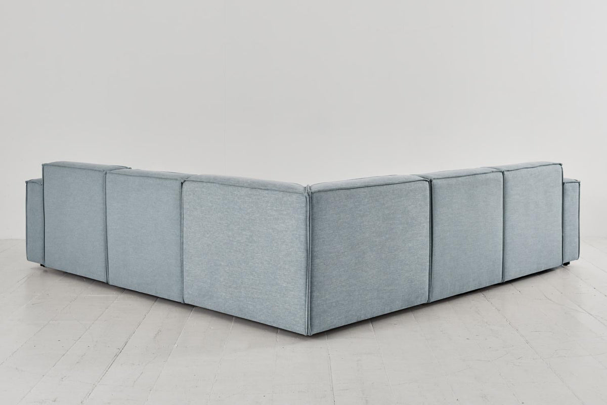 Ecksofa Model 03 mit Polsterhocker, Meerglasblau