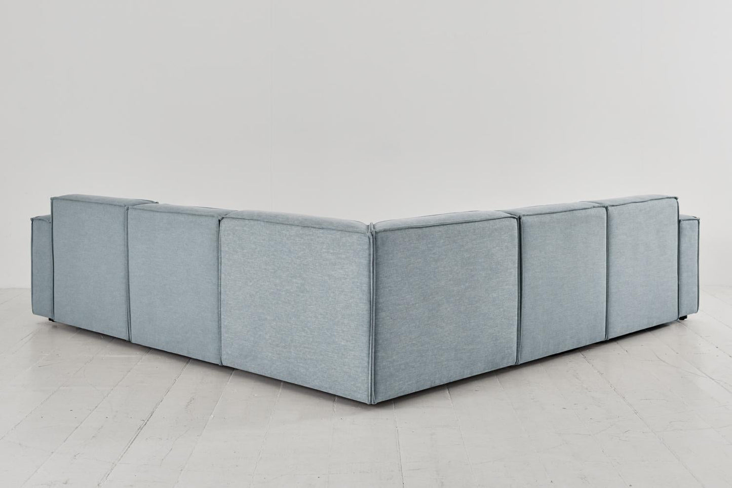 Ecksofa Model 03 mit Polsterhocker, Meerglasblau